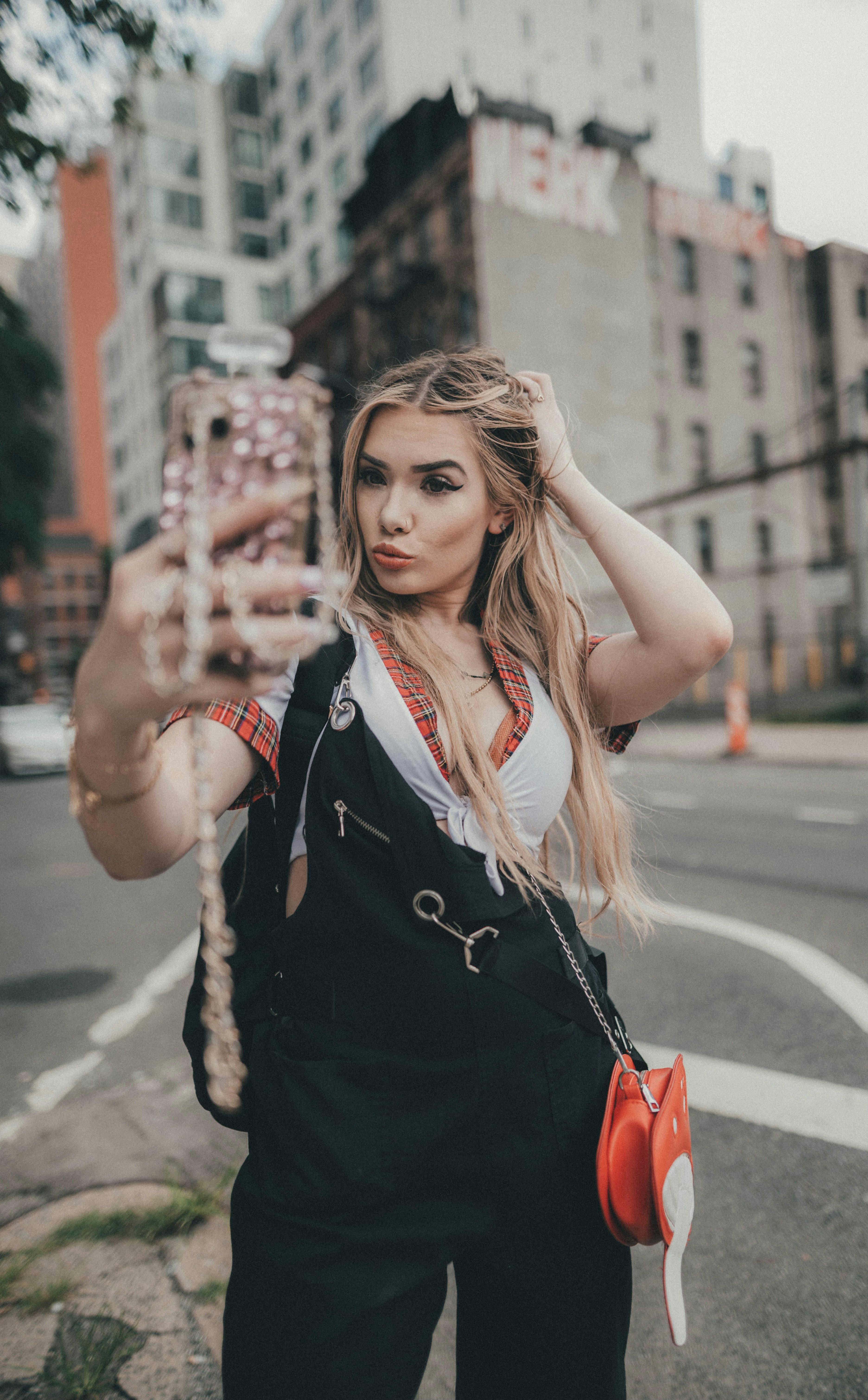 great photo recipe,how to photograph woman in black sleeveless dress holding her hair