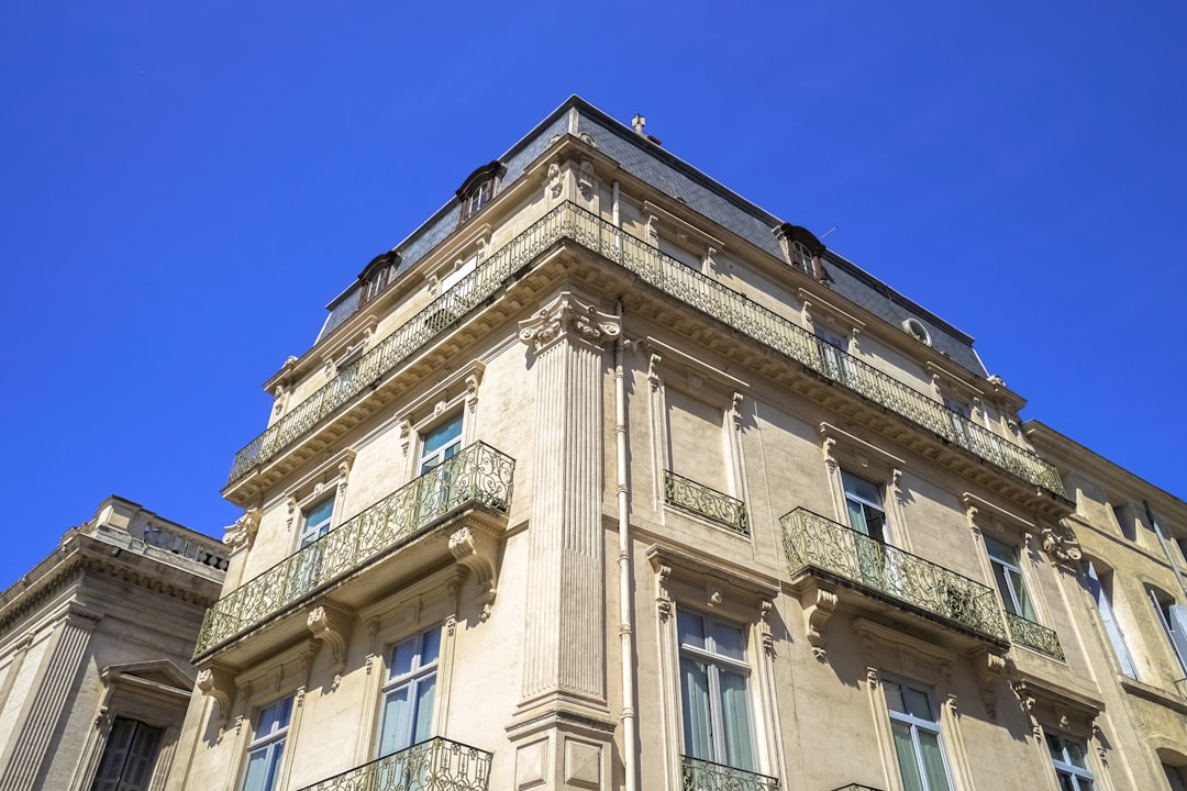 beige concrete building under blue sky during daytime