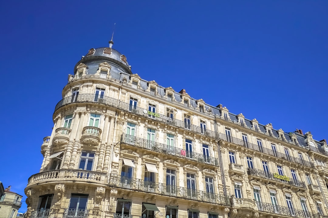 beige concrete building under blue sky during daytime