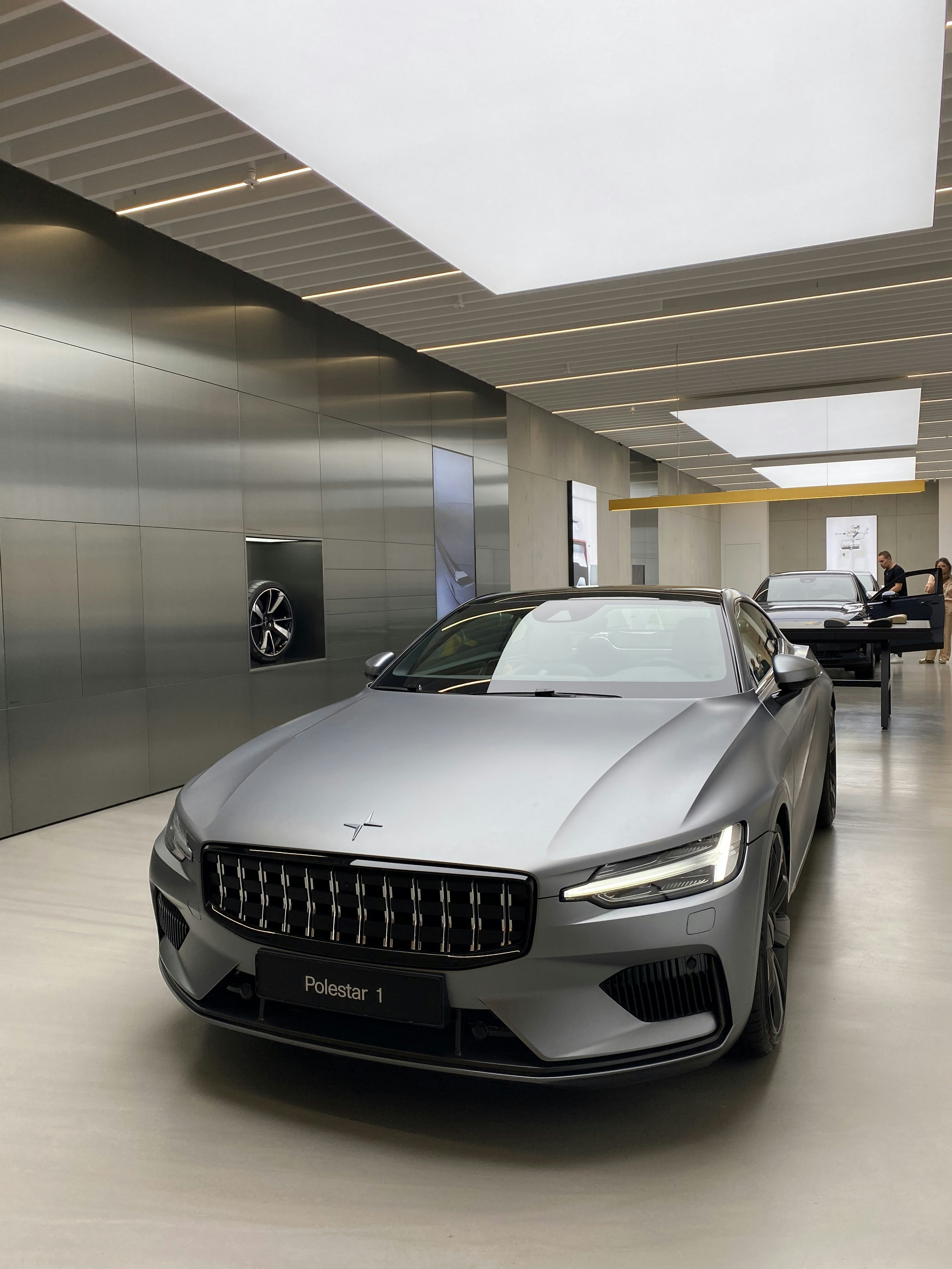 silver bmw m 3 parked in building