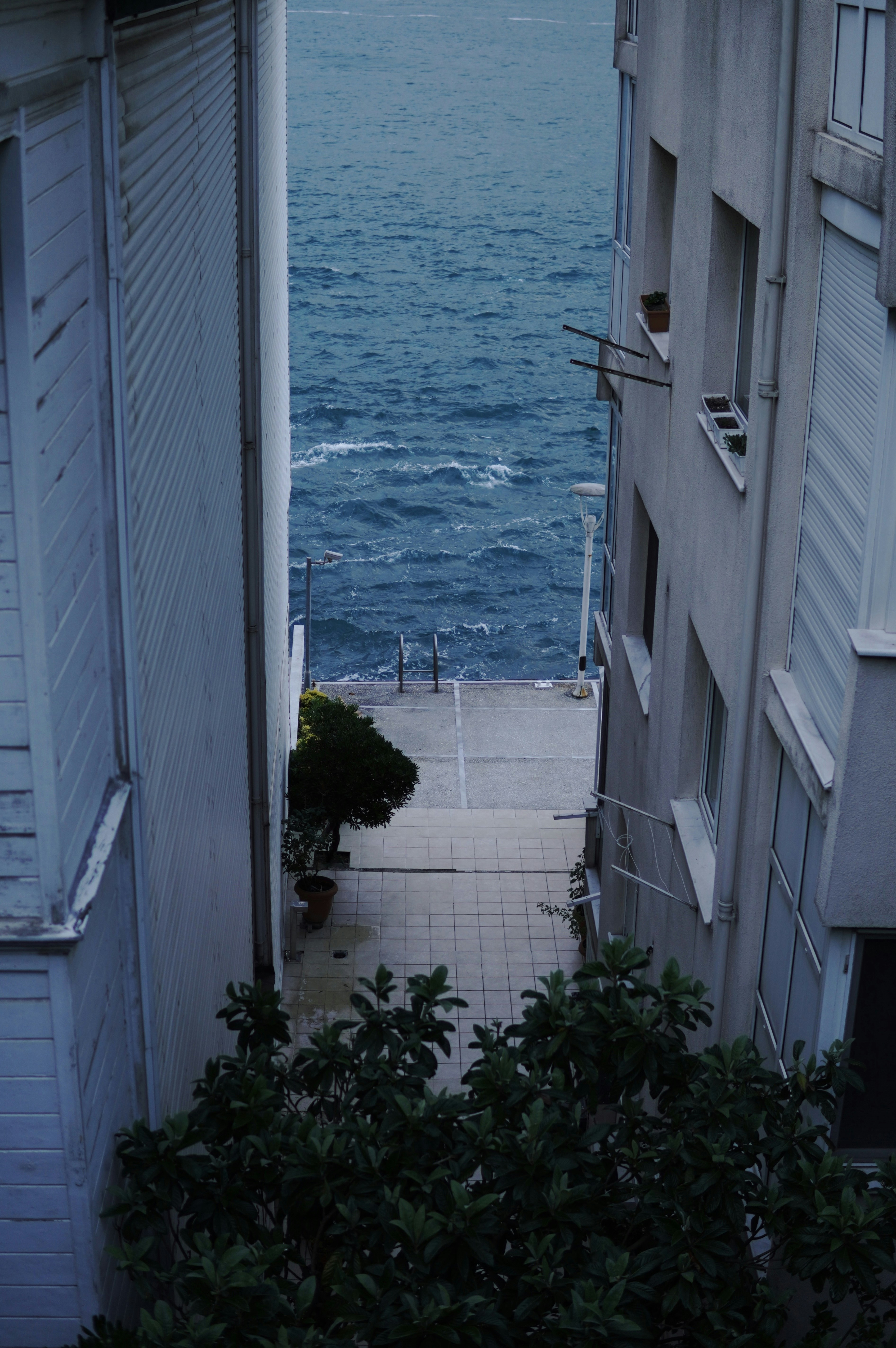 white concrete building near body of water during daytime