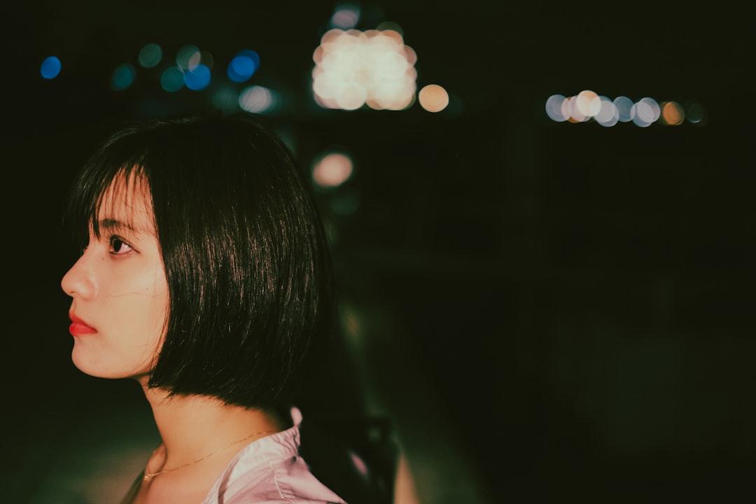 woman in white shirt with bokeh lights