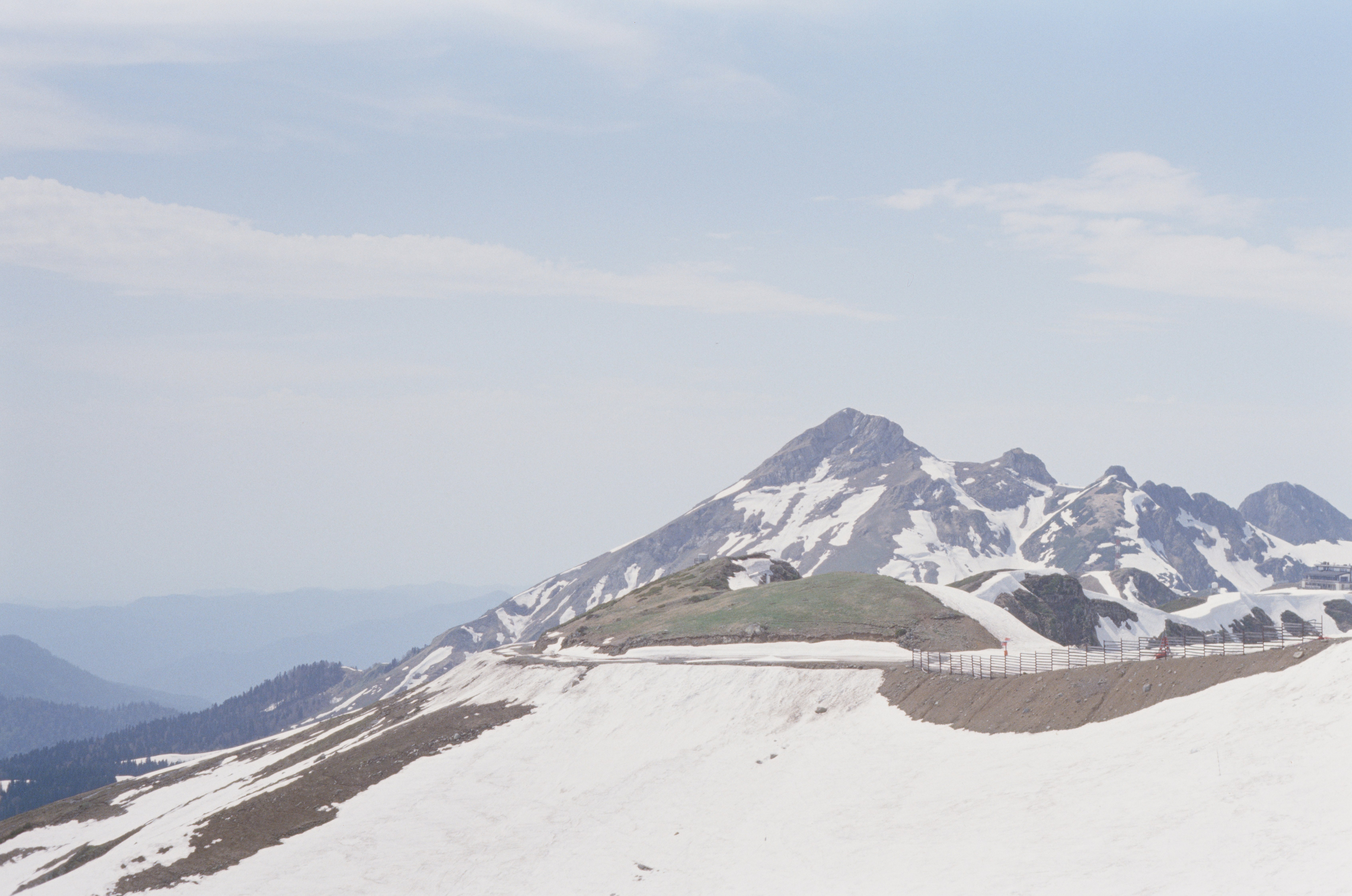 white snow covered mountain under white cloudy sky during daytime