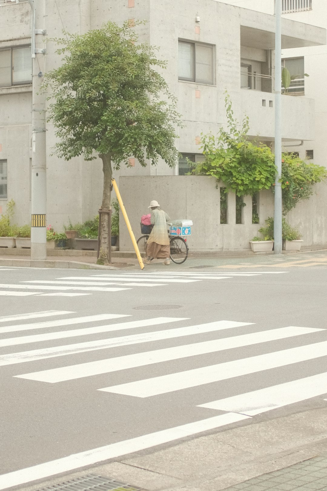 man in black jacket riding bicycle on road during daytime