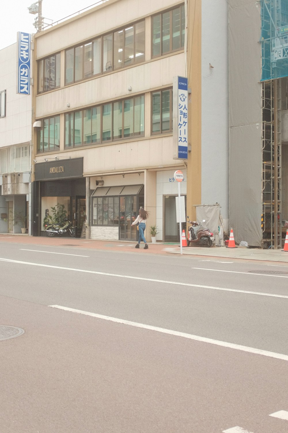 people walking on sidewalk near building during daytime