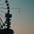 black ferris wheel under gray sky