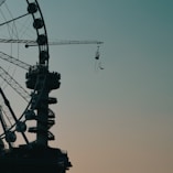 black ferris wheel under gray sky
