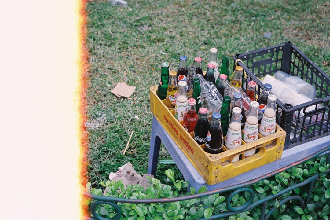 bottles on yellow wooden crate