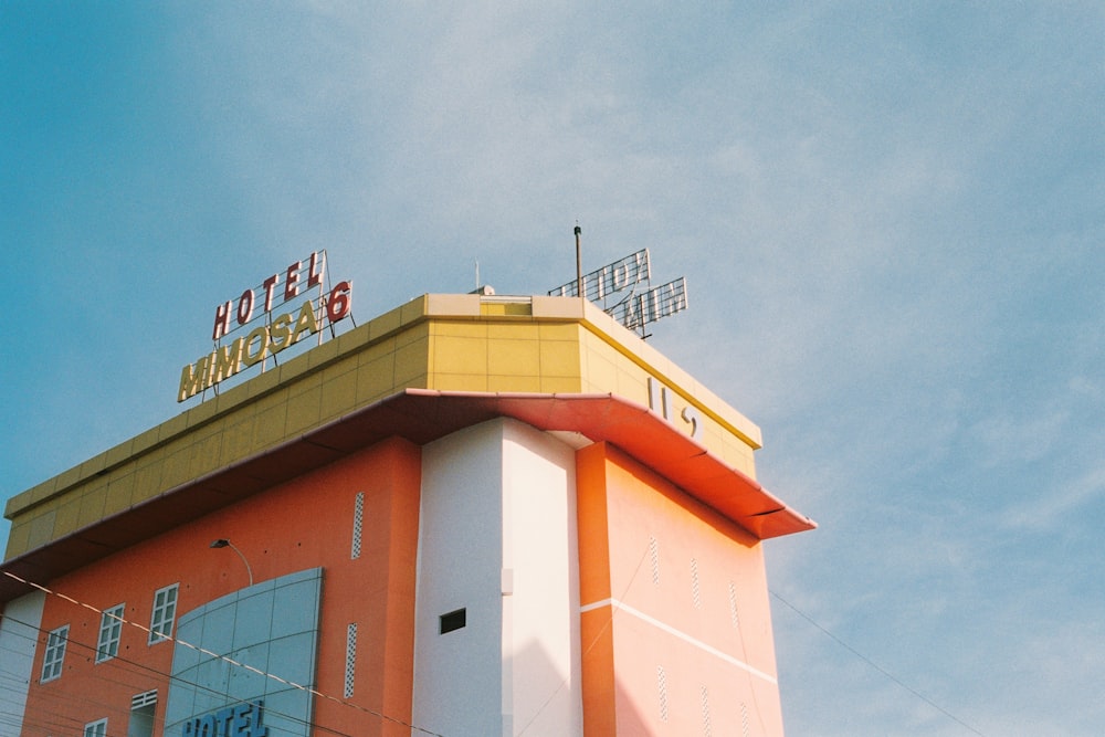 brown and white concrete building under blue sky during daytime