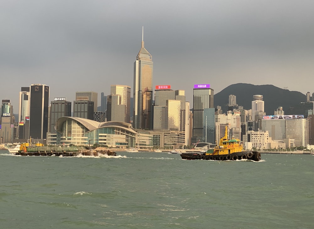 city skyline across body of water during daytime