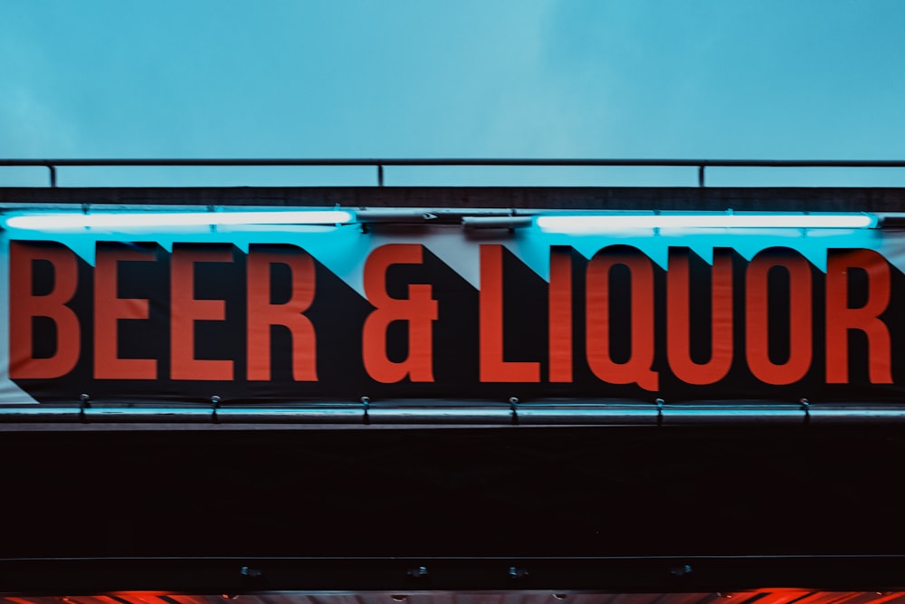 a neon sign that says beer and liquor