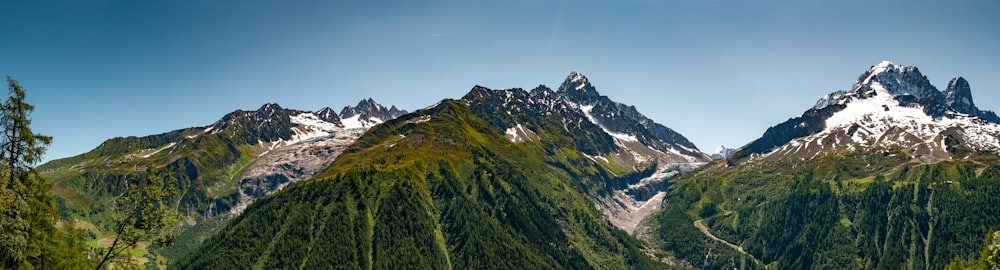 green and white mountains under blue sky during daytime