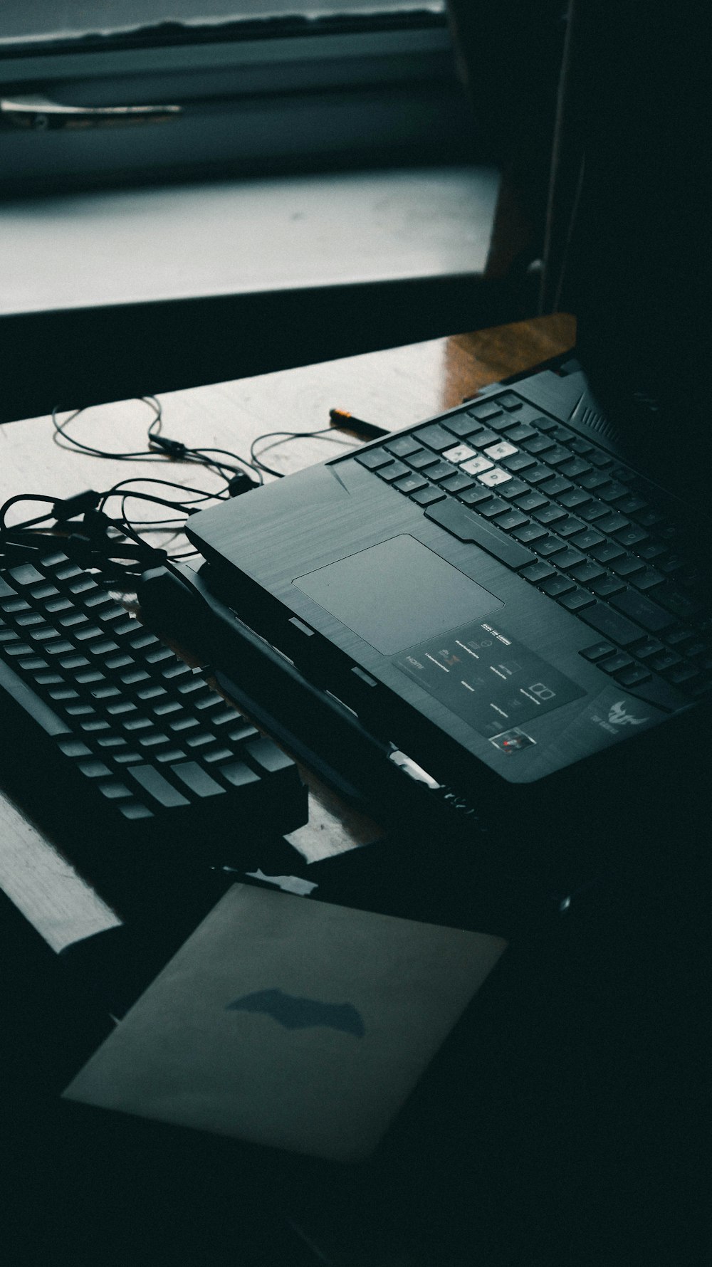 black laptop computer on white table