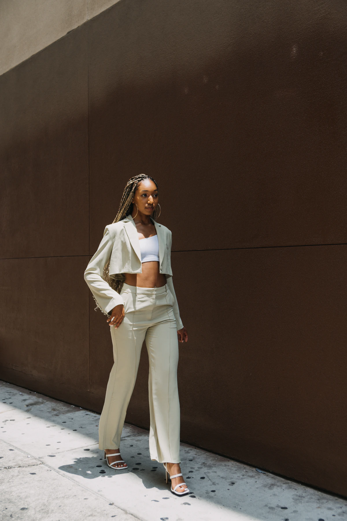 Model wearing white shirt and trousers