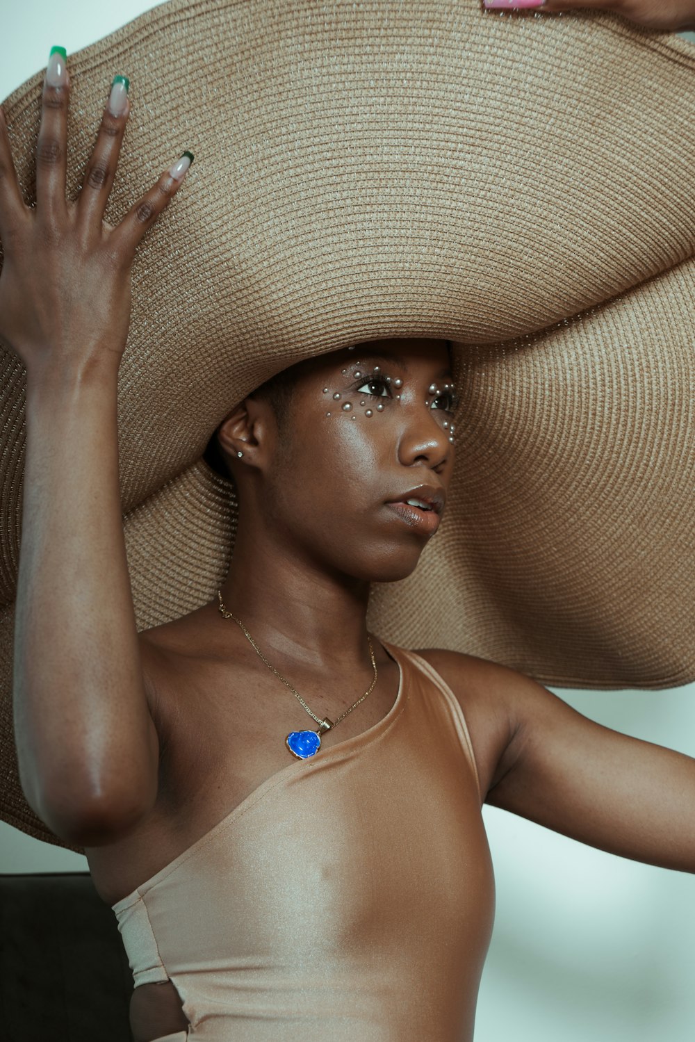 woman in brown sun hat