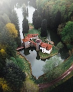 brown and white house on river