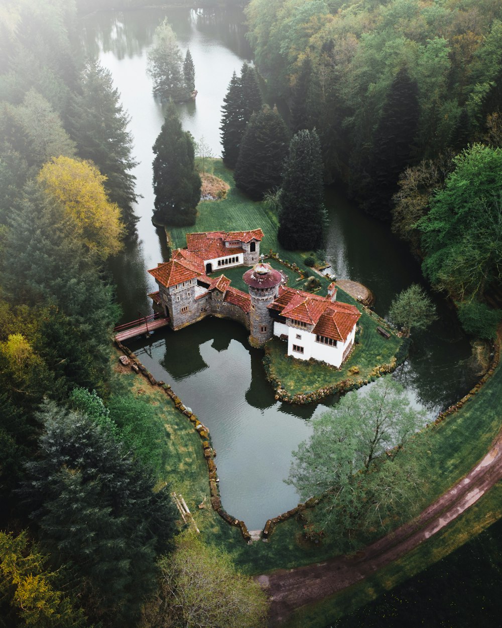 brown and white house on river