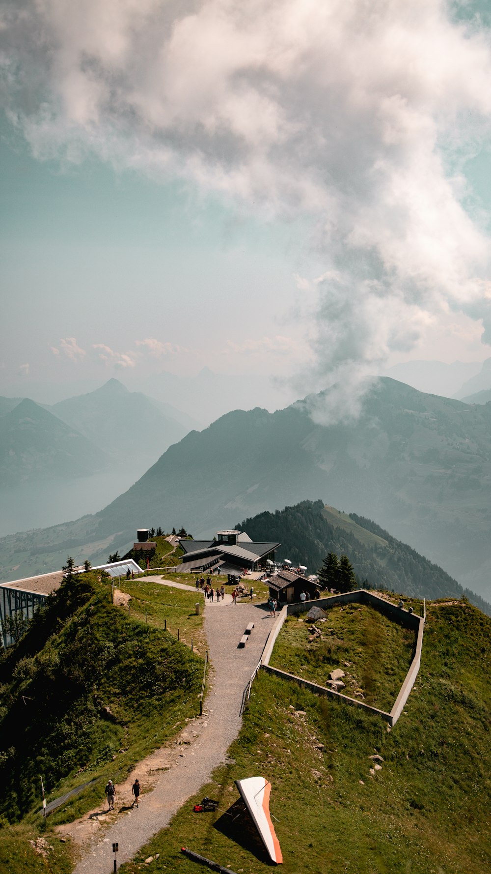 white and brown concrete house on top of mountain