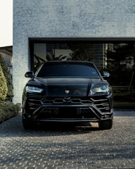 black bmw car parked near building
