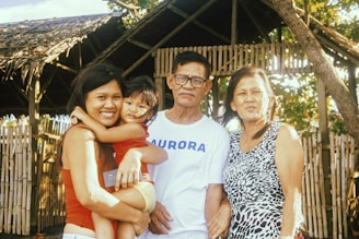 3 women and man smiling