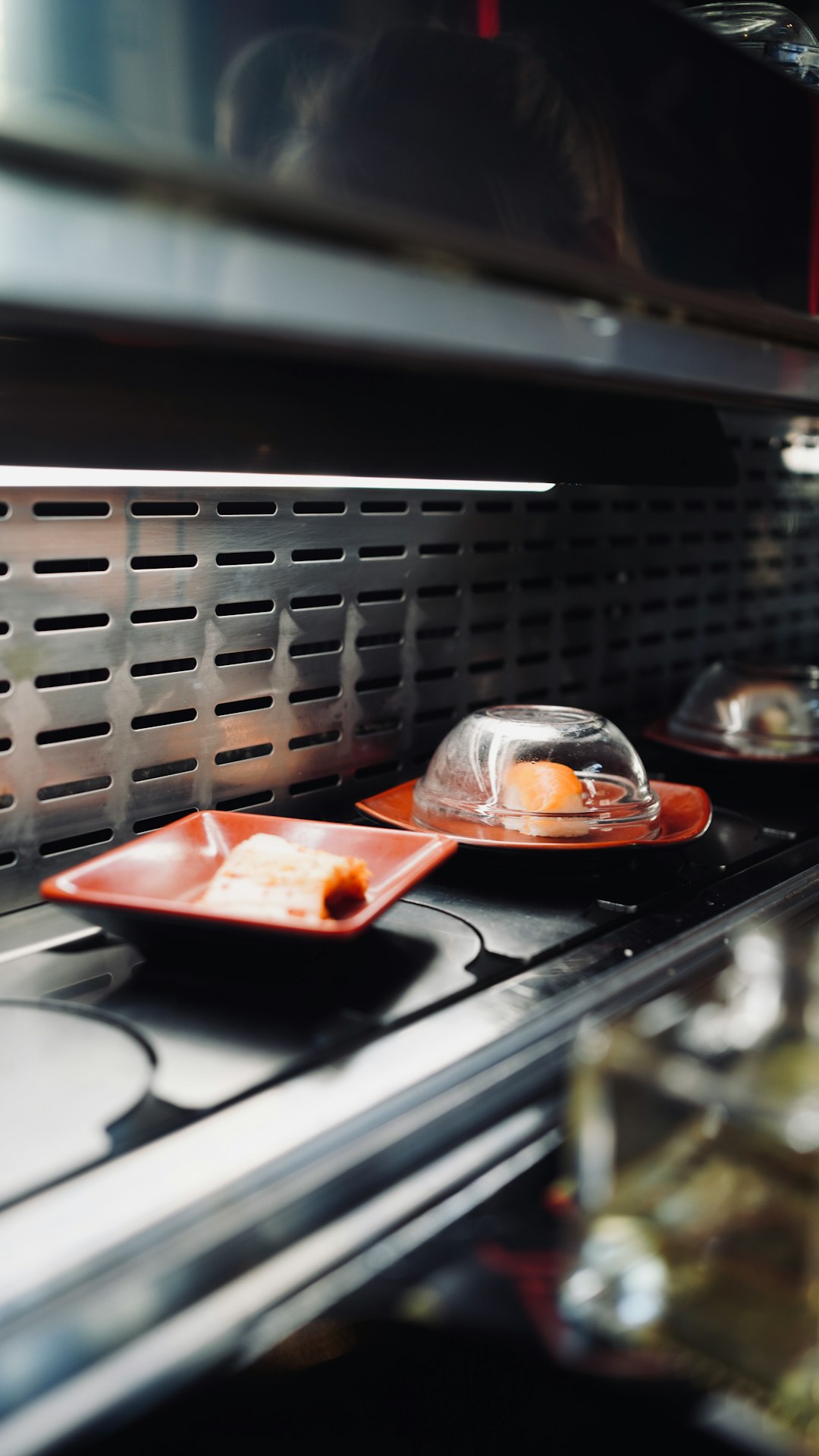 red and white ceramic bowl on stainless steel tray