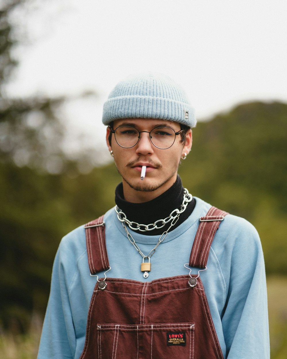 man in red and white zip up jacket wearing white knit cap