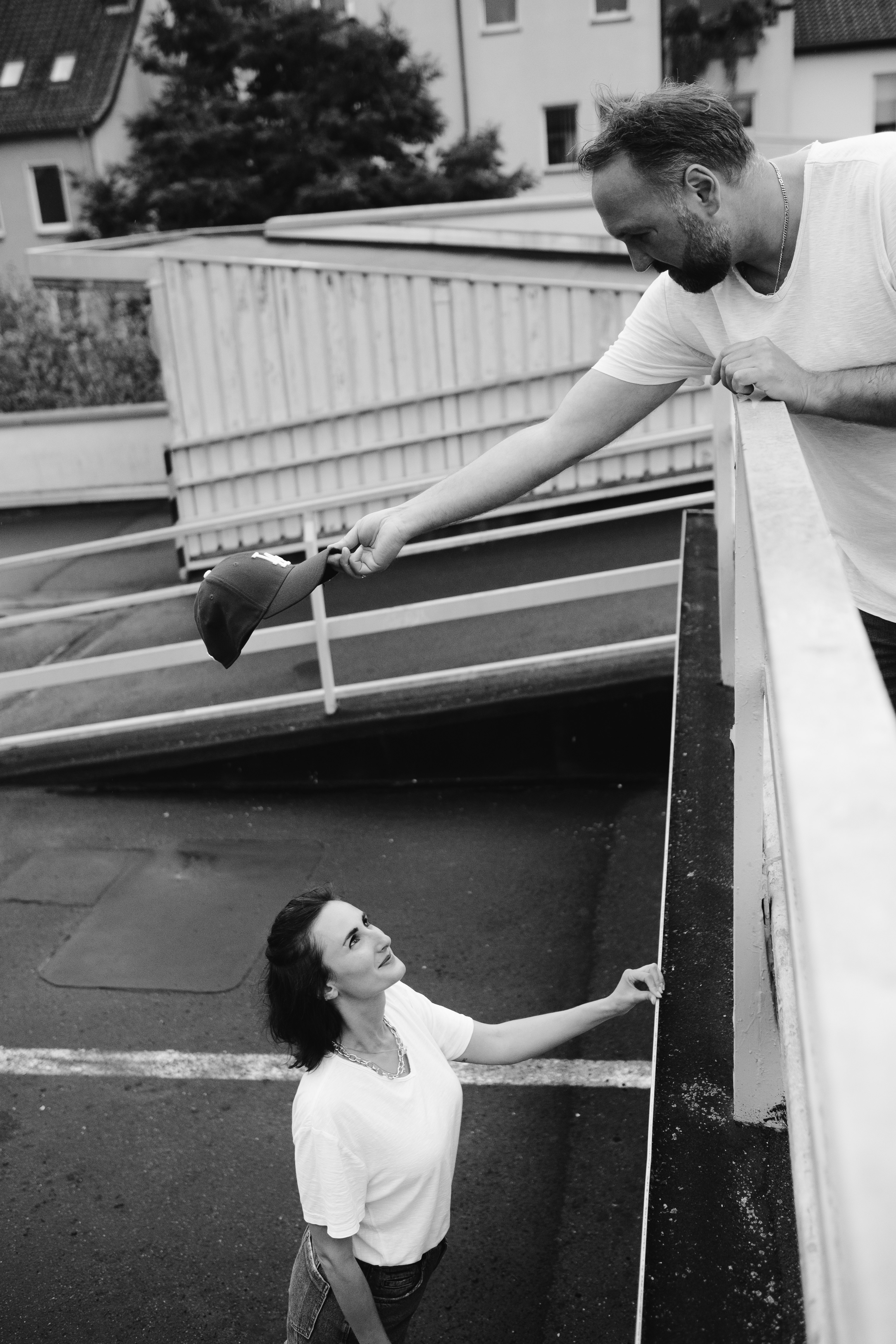 woman in white tank top and black pants climbing on stairs