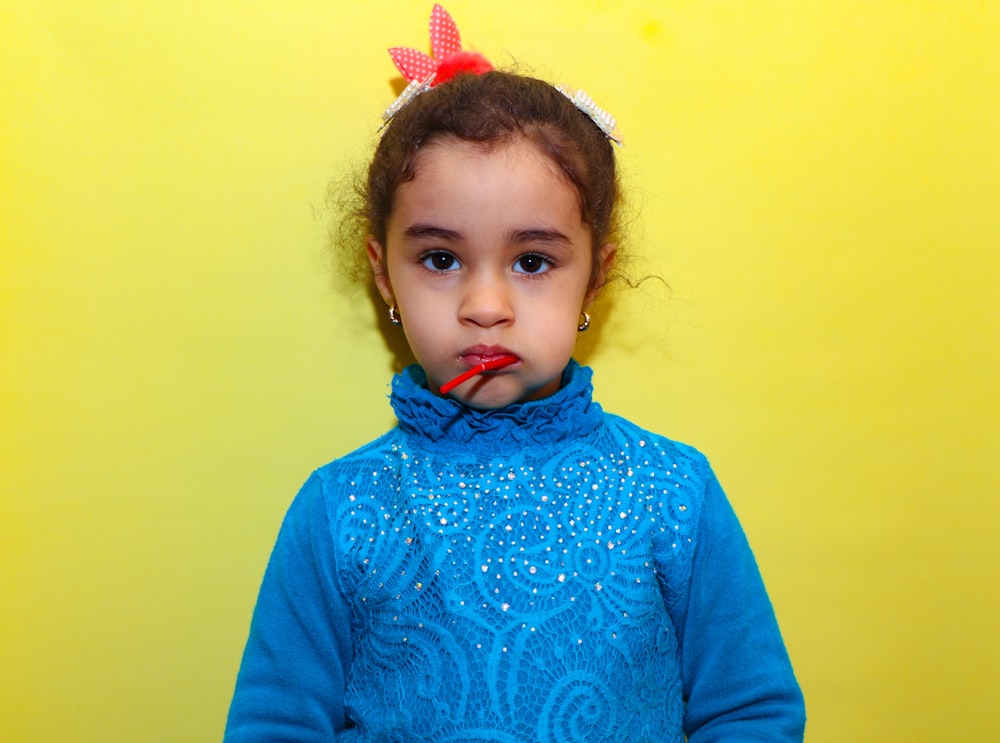 girl in blue long sleeve shirt