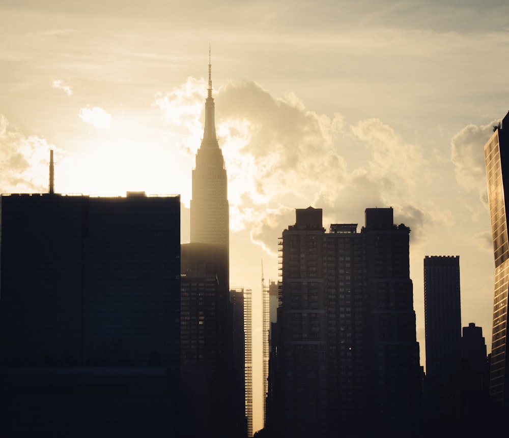 silhouette of city buildings during sunset