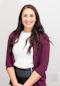 woman in red cardigan smiling