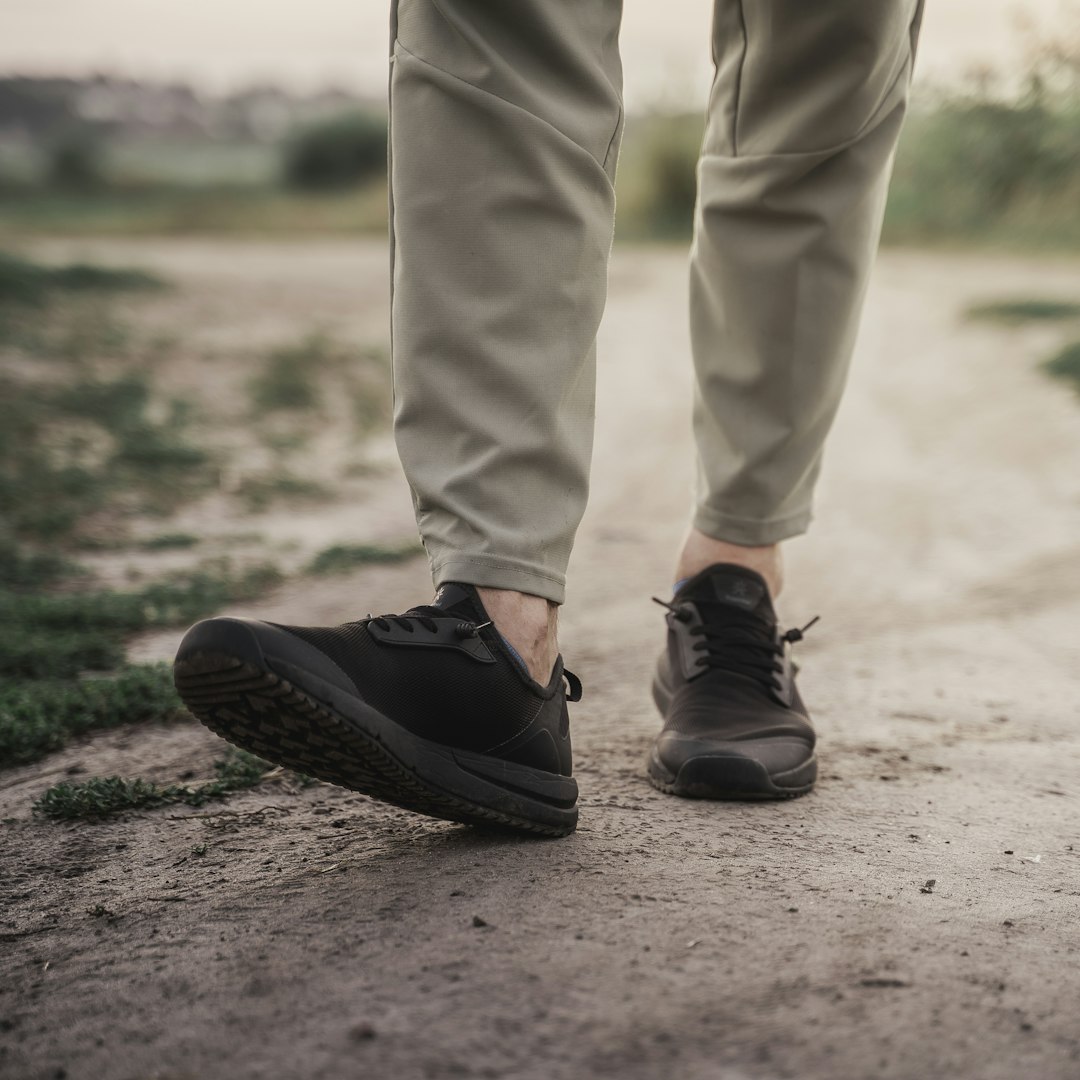 person in brown pants and black shoes