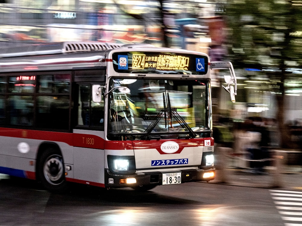 red and white double decker bus on road during daytime