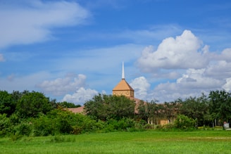 A serene image of a church building surrounded by nature, symbolizing peace and community.