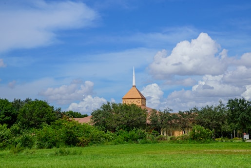 A serene landscape featuring a peaceful church surrounded by nature, symbolizing faith and tranquility.