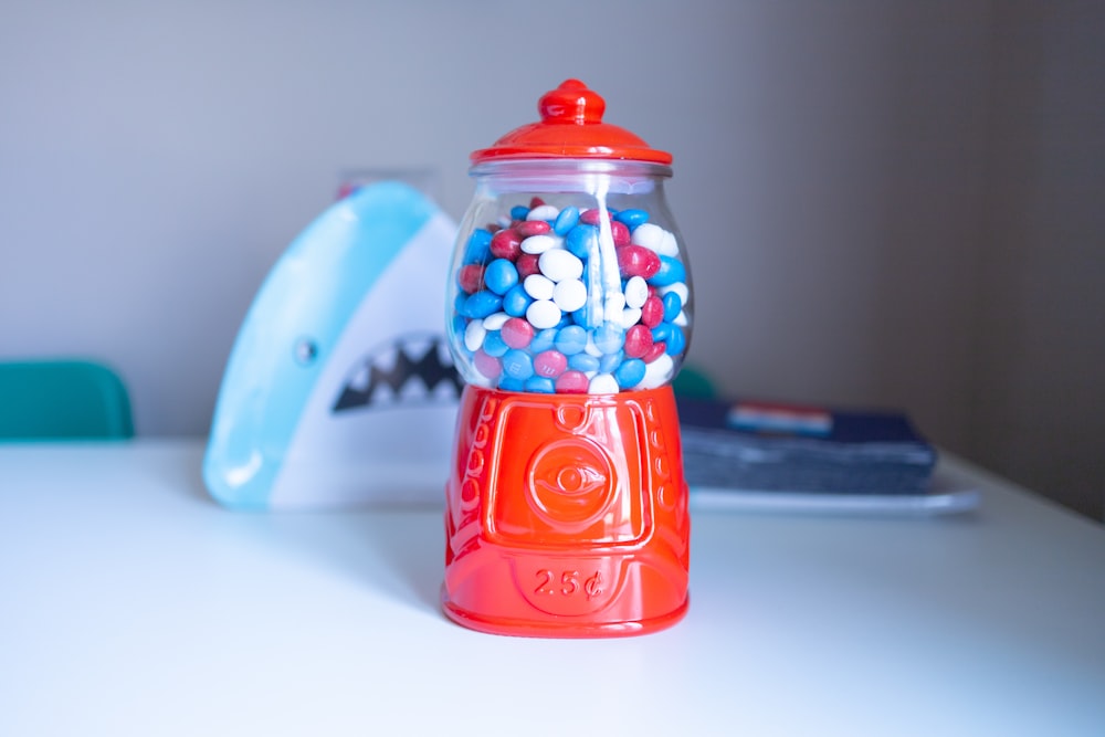 red and white ceramic container