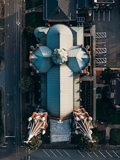 white and black umbrella on black steel fence