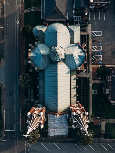white and black umbrella on black steel fence