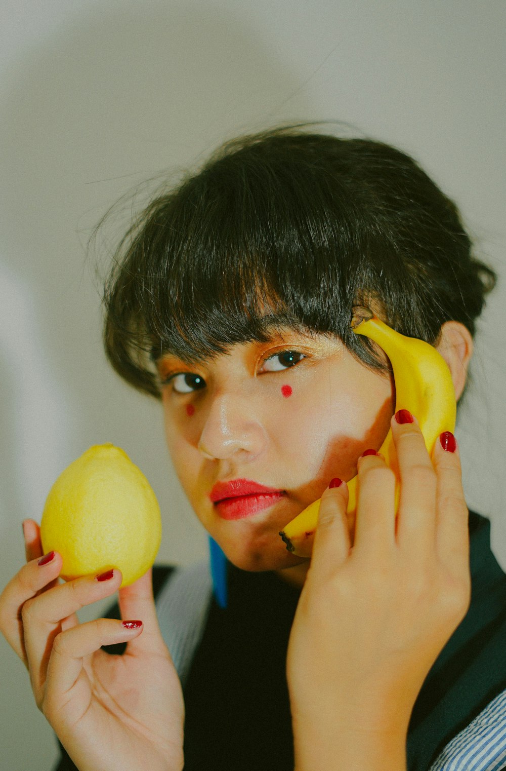 boy holding yellow lemon fruit