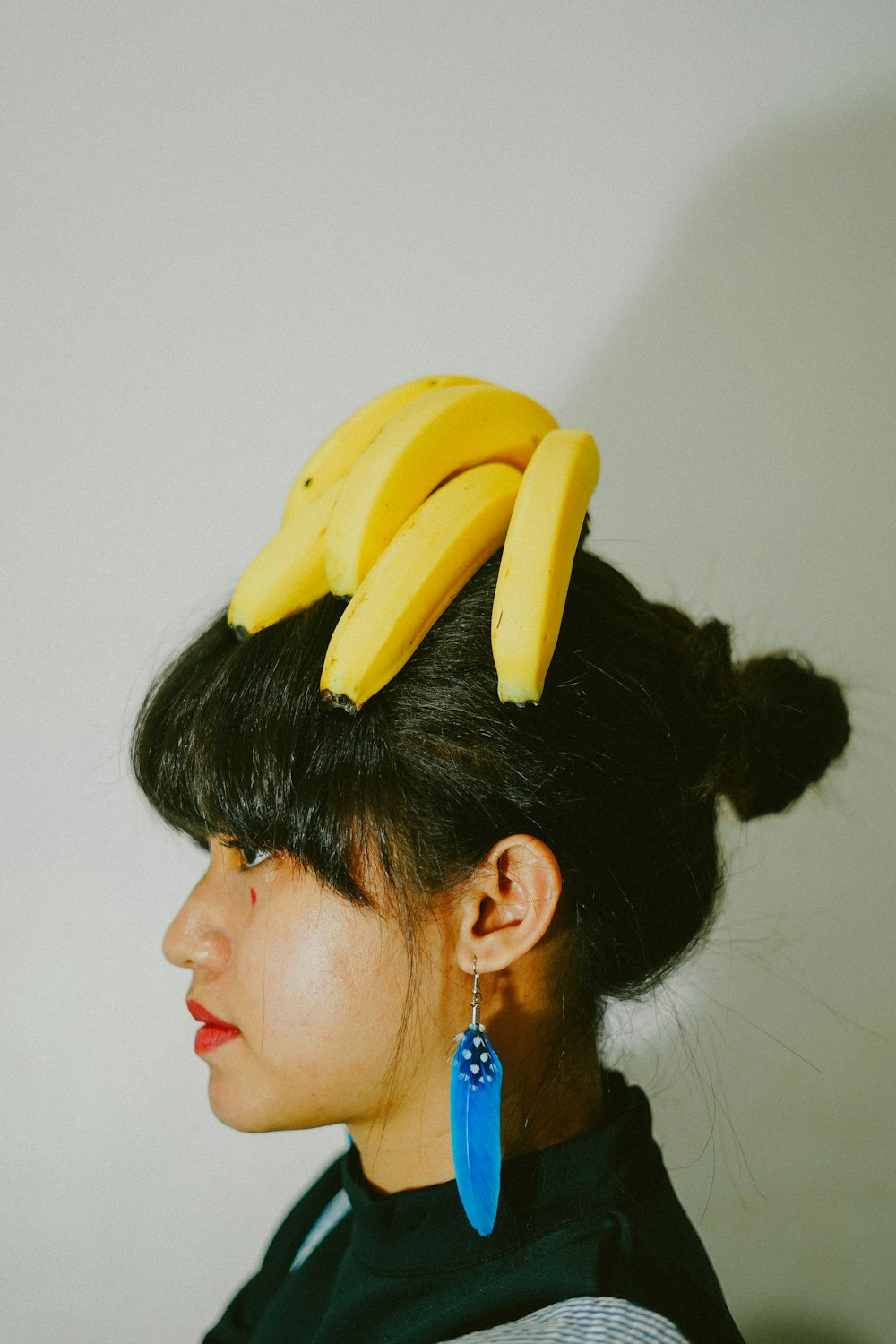 woman with yellow banana on her head
