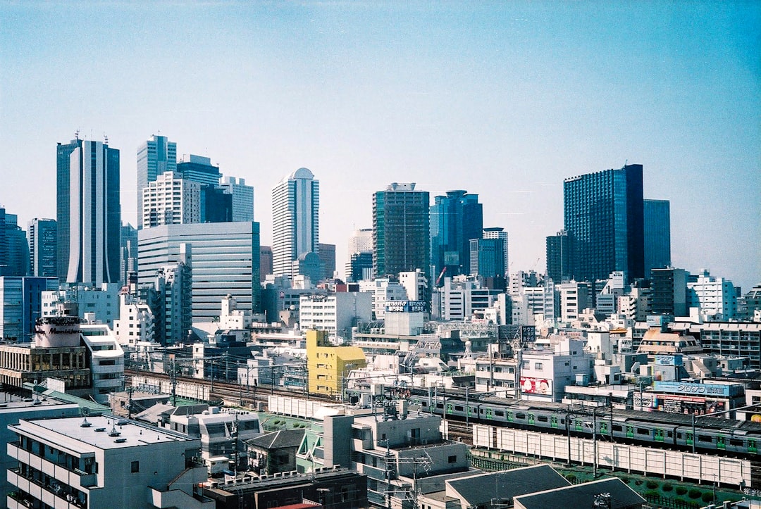 city buildings under blue sky during daytime