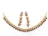 A set of decorative jewelry consisting of a necklace and matching earrings, designed with a series of gold links adorned with red teardrop-shaped stones and clear round gemstones.
