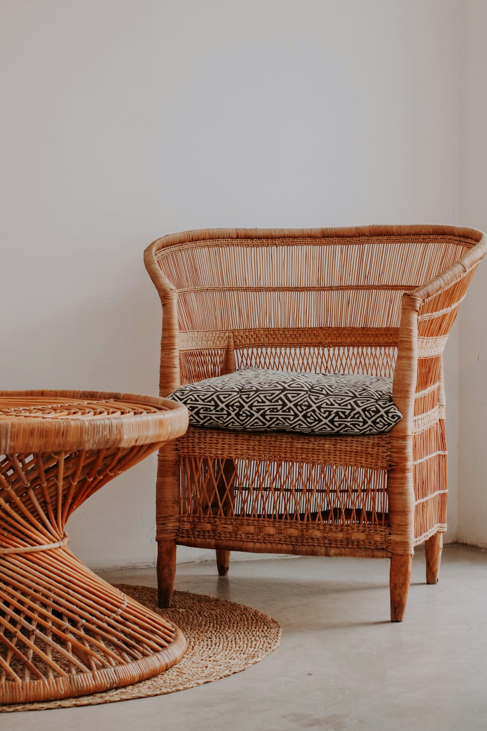 brown wooden framed gray padded armchair