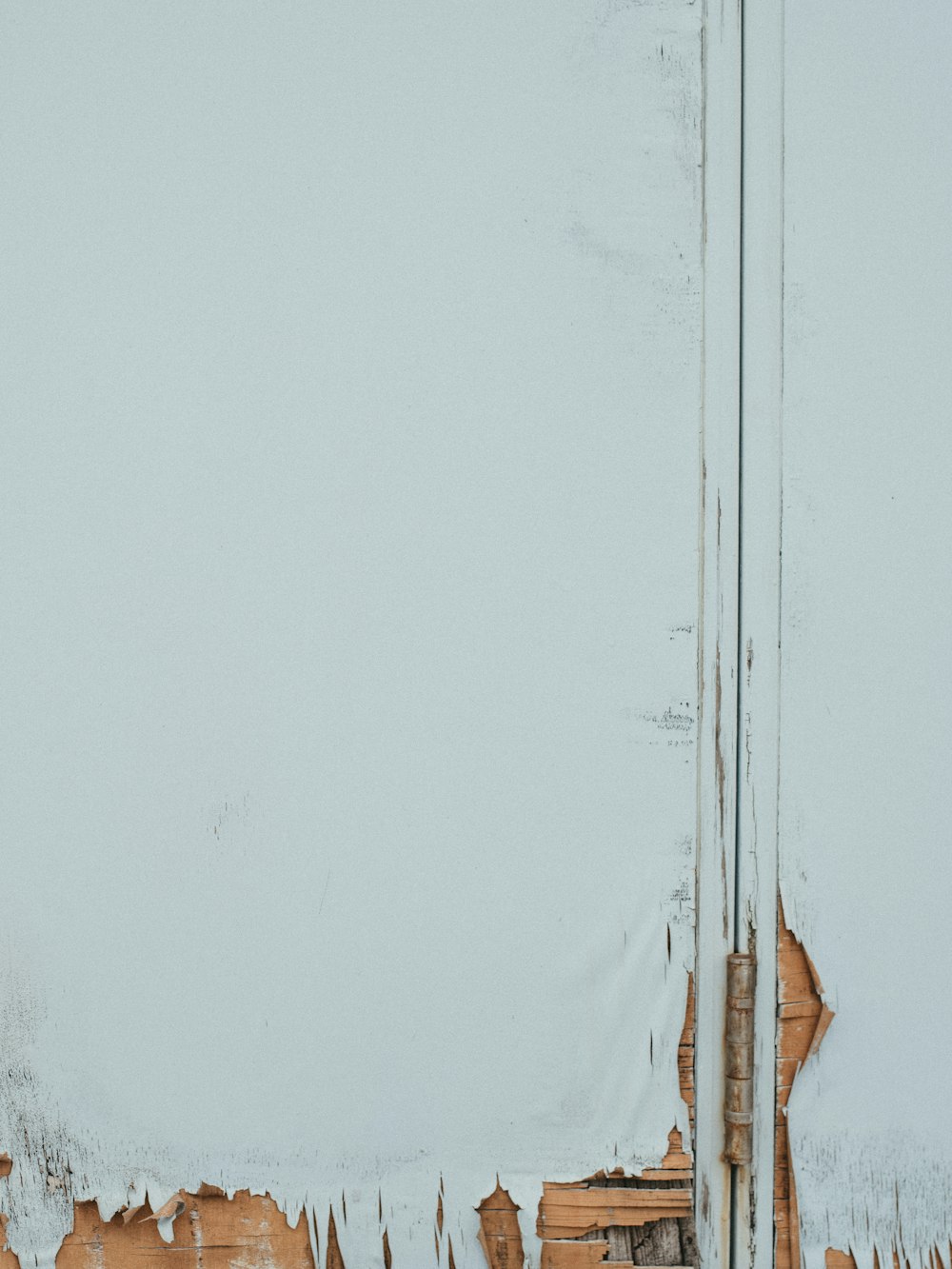 white textile on brown wooden clothes hanger