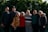 group of people standing near green trees during daytime