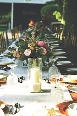 red and white roses in clear glass vase on table