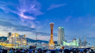 people walking on street near high rise buildings during daytime
