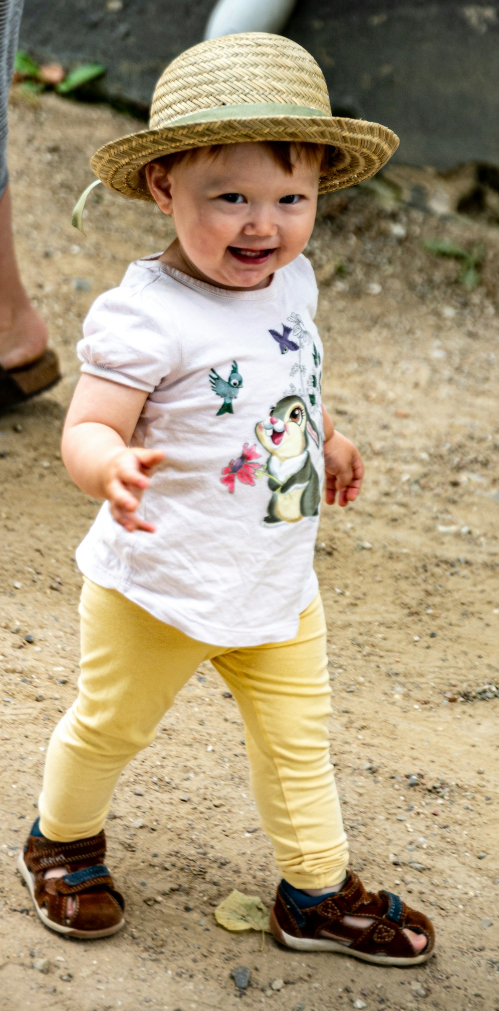 girl in white shirt and yellow pants