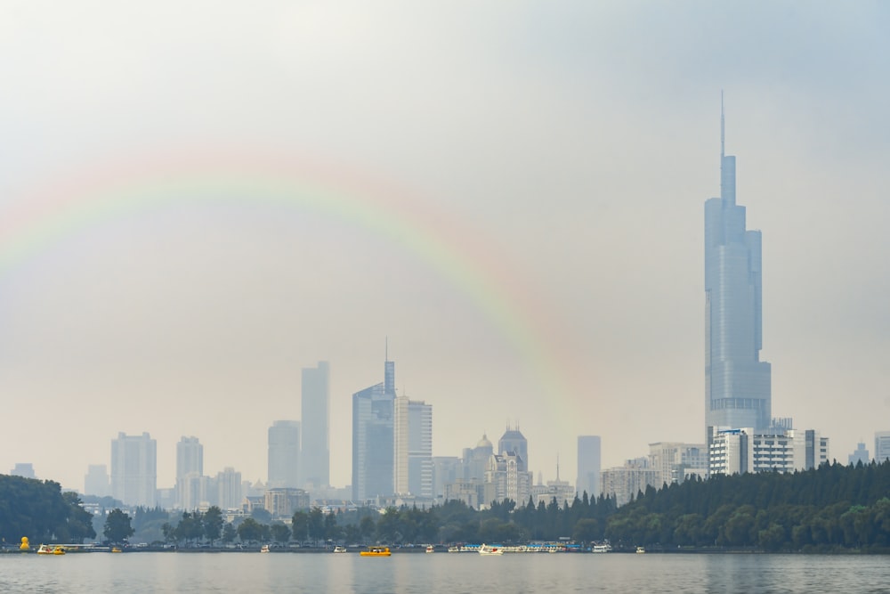 rainbow over city skyline during daytime