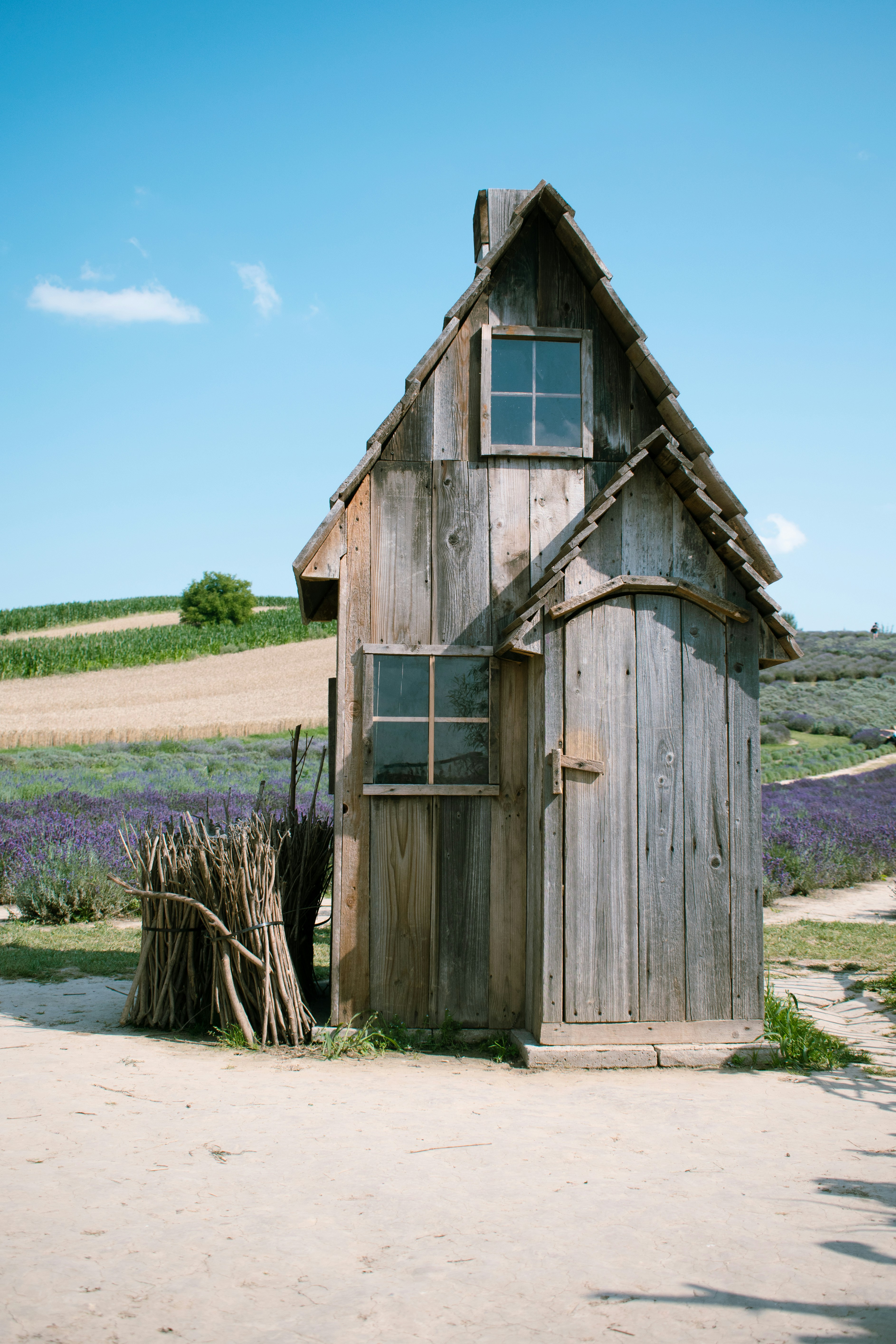 Brown wooden house near green grass field during daytime photo – Free ...
