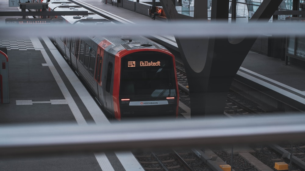 red and black train on train station during daytime